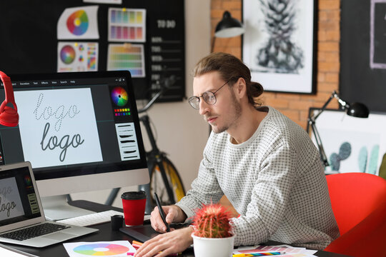 Graphic Designer Working at a Desk